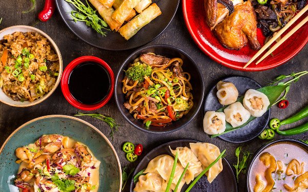 Assorted Asian dishes including noodles, dumplings and more