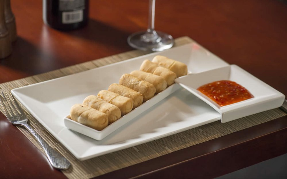 Appetizer portion of tequenos with a dip at Miranda Cuisine & Bar