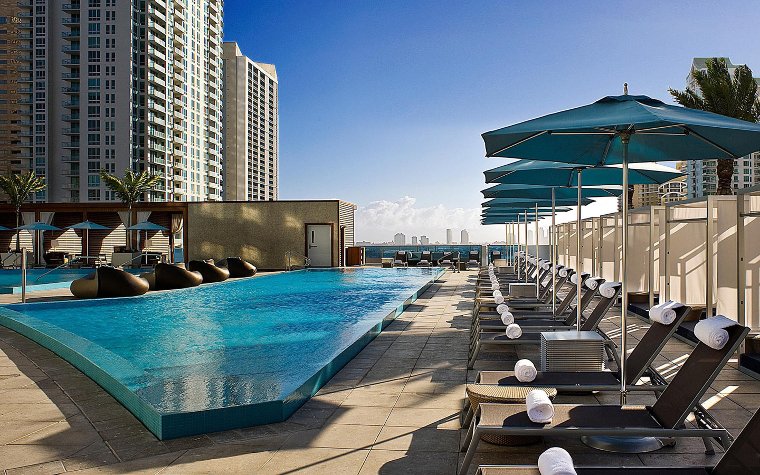 Kimpton EPIC Hotel pool area and loungers Kimpton EPIC Hotel pool area and loungers