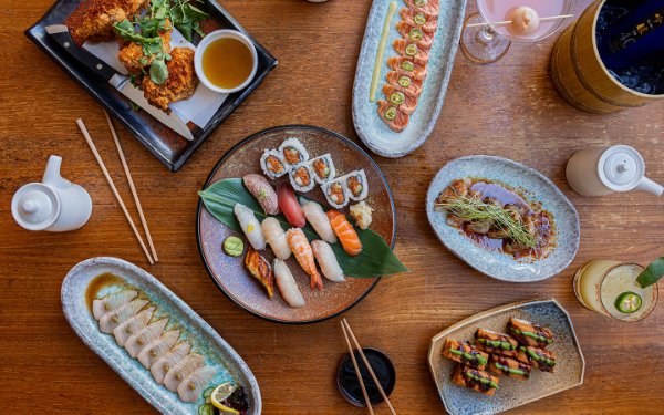 Table spread at Blue Ribbon with gourmet dishes, sushi