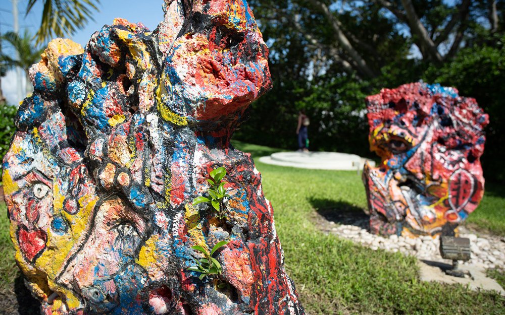 Captivating sculptures displayed at Hialeah’s Garden of the Arts, surrounded by lush greenery and pathways