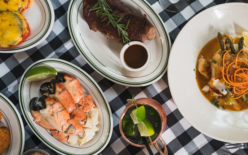 Table spread at Joe's Stone Crab featuring steak and stone crab claws  Table spread at Joe's Stone Crab featuring steak and stone crab claws