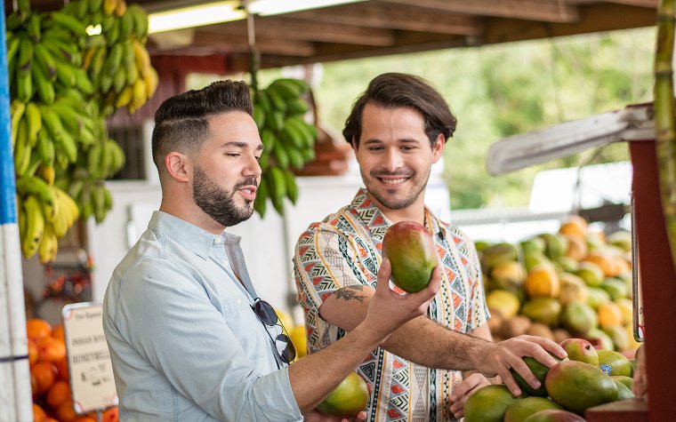 Men enjoying mango picking at Robert Is Here Men enjoying mango picking at Robert Is Here