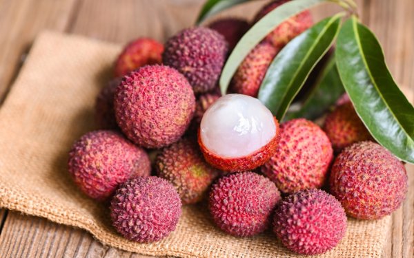 Lychee fruit and one is cut open